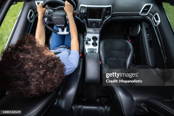 woman driving a car - automatic stock pictures, royalty-free photos & images