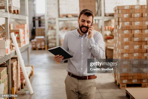 multitasking at work - industrial labourer stock pictures, royalty-free photos & images