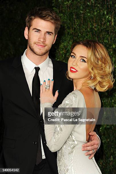 Actor Liam Hemsworth and actress/singer Miley Cyrus arrive at the 2012 Vanity Fair Oscar Party hosted by Graydon Carter at Sunset Tower on February...