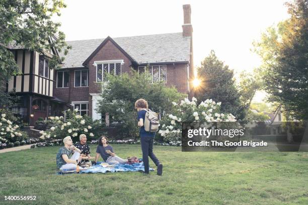 group of friends hanging out on college campus - university student picnic stock pictures, royalty-free photos & images