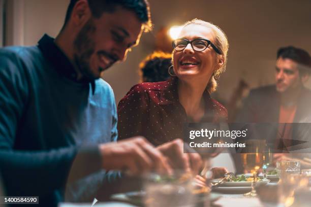 group of friends having fun during a dinner celebration - party social event stock pictures, royalty-free photos & images