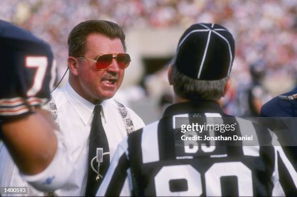Head coach Mike Ditka of the Chicago Bears, left, has a few words with an official during the Bears 33-28 loss to the Houston Oilers at Soldier Field...