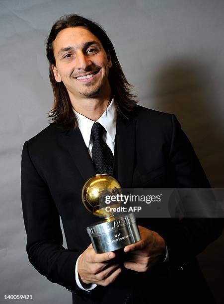 Milan's Swedish player Zlatan Ibrahimovic poses with the Golden Ball award during the Swedish Football Gala at the Globe Arena in Stockholm on...