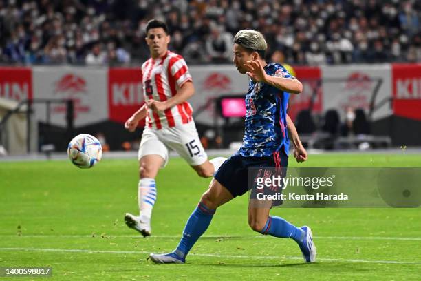 Takuma Asano of Japan scores his side's first goal during the international friendly match between Japan and Paraguay at Sapporo Dome on June 2, 2022...