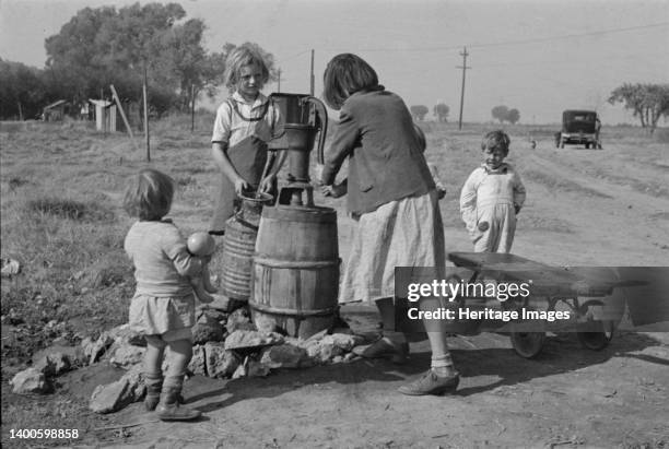 Water supply, American River camp, California, San Joaquin Valley. Artist Dorothea Lange.