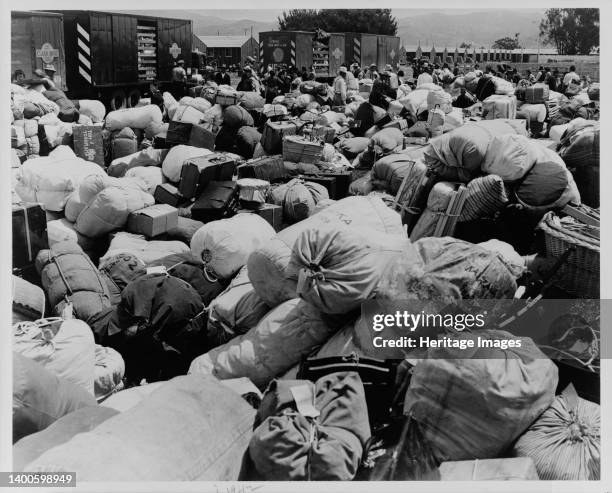 Japanese relocation, California. Baggage belonging to evacuees of Japanese ancestry at an assembly center in Salinas, California, prior to a War...