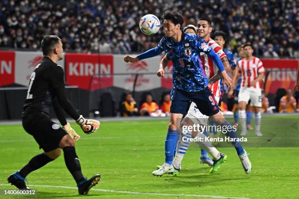 Daichi Kamada of Japan beats Santiago Rojas to score his side's second goal during the international friendly match between Japan and Paraguay at...