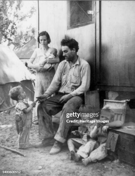 Texas tenant farmer in Marysville, California, migrant camp during the peach season. 1927 made seven thousand dollars in cotton. 1928 broke even....