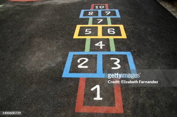 high angle view of colorful hopscotch drawn on street - number 7 foto e immagini stock