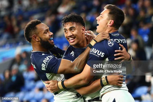 Murray Taulagi of the Cowboys celebrates scoring a try during the round 13 NRL match between the Gold Coast Titans and the North Queensland Cowboys...