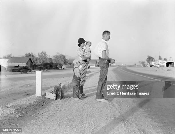 Example of self-resettlement in California. Oklahoma farm family on highway between Blythe and Indio. Forced by the drought of 1936 to abandon their...