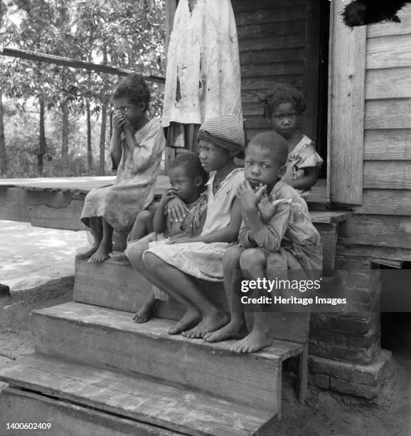 Turpentine worker's family near Cordele, Alabama. Father's wages one dollar a day. This is the standard of living the turpentine trees support....