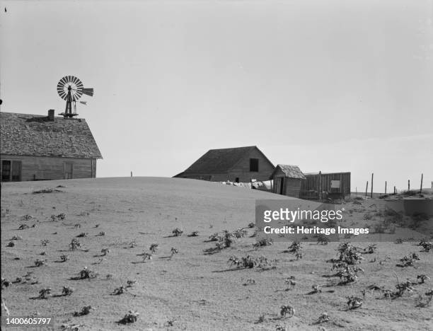 Dust Bowl farm. Coldwater District, near Dalhart, Texas. This farm is occupied. Others in this area have been abandoned. Artist Dorothea Lange.