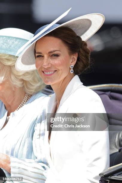 Catherine and Duchess of Cambridge ride in a carriage during the Trooping the Colour parade on June 02, 2022 in London, England. The Platinum Jubilee...