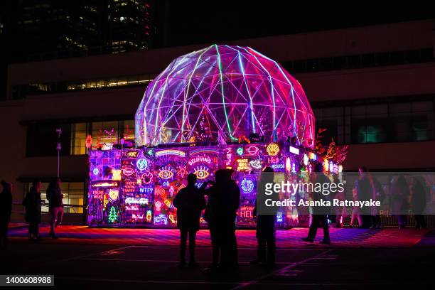 People look at a installation at Golden Square, an art and performance display held in a car park, as part of RISING Festival on June 02, 2022 in...