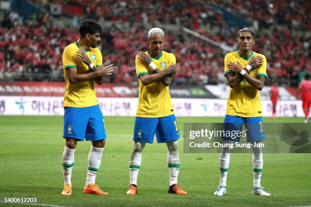 Neymar Jr. Of Brazil celebrates scoring his side's second goal with his teammates Lucas Paqueta and Raphinha during the international friendly match...