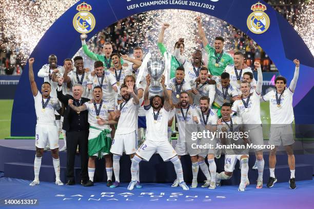Real Madrid celebrate on the stage during the trophy presentation ceremony following the 1-0 victory in the UEFA Champions League final match between...