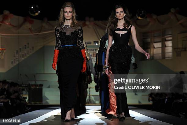 Models display creations as part of Dsquared2 Fall-winter 2012-2013 show on February 27, 2012 during the Women's fashion week in Milan. AFP PHOTO /...