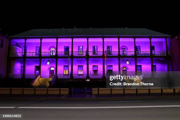 Parliament of New South Wales is illuminated purple on June 02, 2022 in Sydney, Australia. Sydney Harbour and its surrounds were lit up to mark The...