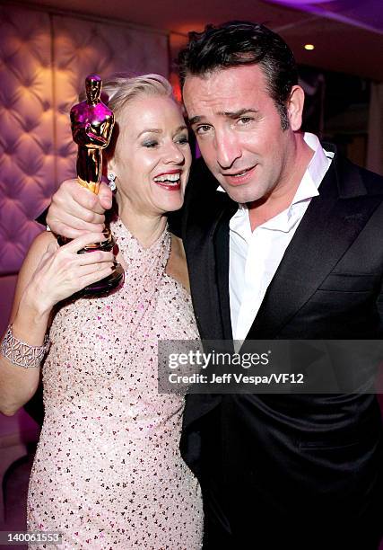 Actor Jean Dujardin and actress Penelope Ann Miller pose with his award for Best Actor for 'The Artist,' at the 2012 Vanity Fair Oscar Party Hosted...