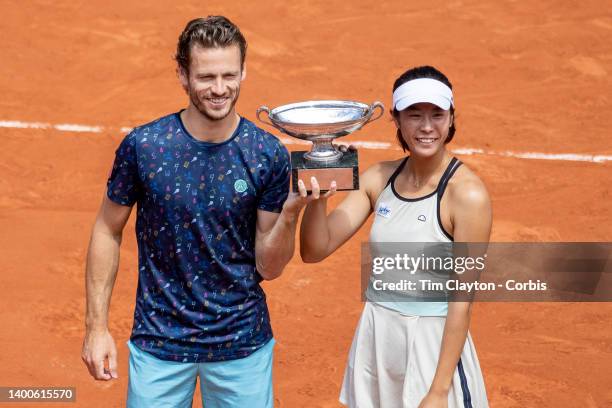 Ena Shibahara of Japan and Wesley Koolhof of The Netherlands with the trophy after winning the Mixed Doubles Final on Court Philippe Chatrier during...