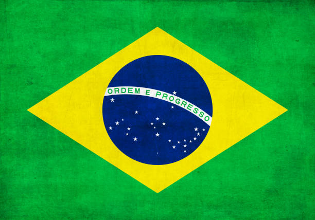 flag of brazil with a grunge texture - brazil flag stock pictures, royalty-free photos & images