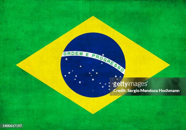 flag of brazil with a grunge texture - brazil flag stock pictures, royalty-free photos & images