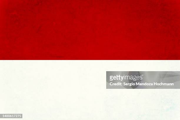 flag of indonesia with a grunge texture - indonesia flag stock pictures, royalty-free photos & images