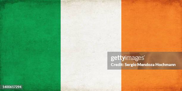 flag of ireland with a grunge texture - ireland flag stock pictures, royalty-free photos & images