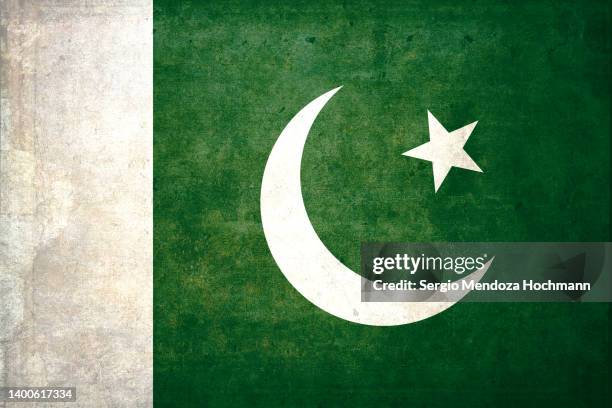 flag of pakistan with a grunge texture - pakistan stockfoto's en -beelden