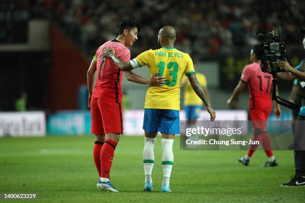 Son Heung-min of South Korea hugs with Dani Alves of Brazil after the international friendly match between South Korea and Brazil at Seoul World Cup...