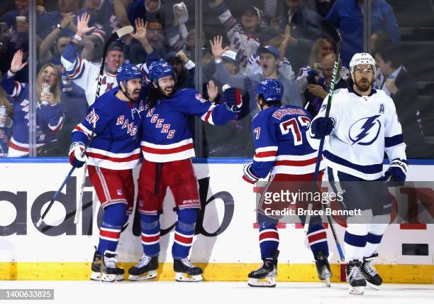 The New York Rangers celebrate a first period goal by Chris Kreider against the Tampa Bay Lightning in Game One of the Eastern Conference Final of...
