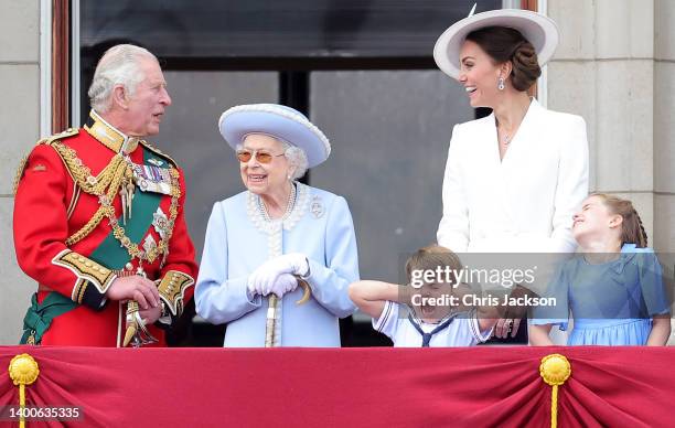Queen Elizabeth II smiles on the balcony of Buckingham Palace during Trooping the Colour alongside Prince Charles, Prince of Wales, Prince Louis of...