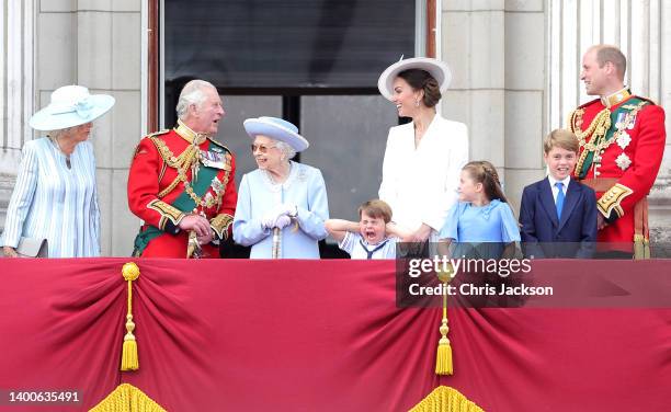 Queen Elizabeth II smiles on the balcony of Buckingham Palace during Trooping the Colour alongside Camilla, Duchess of Cornwall, Prince Charles,...