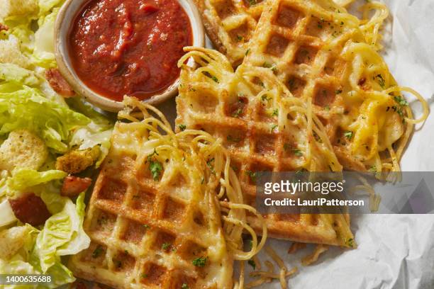 crispy spaghetti waffles with mozzarella cheese - savory sauce stock pictures, royalty-free photos & images