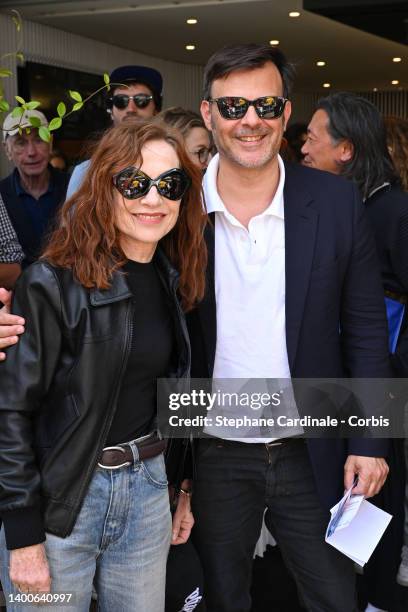 Isabelle Huppert and Francois Ozon attend the French Open 2022 at Roland Garros on June 02, 2022 in Paris, France.