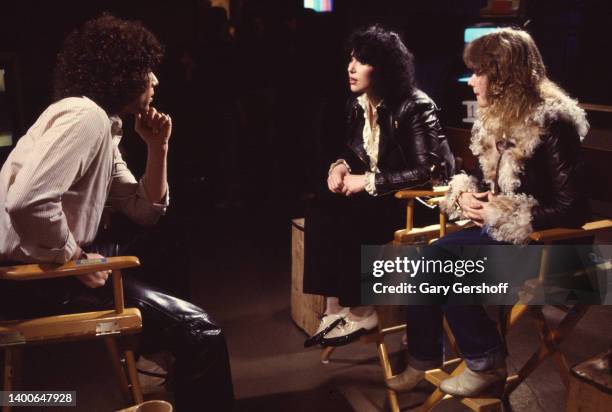 View, from left, of MTV VJ Mark Goodman and American siblings & Rock musicians Ann Wilson and Nancy Wilson, the latter two of the group Heart, as...