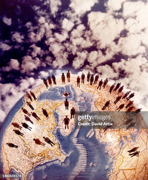 Photo montage of multi-ethnic group of people standing on a globe, in 1975 in New York City, New York.