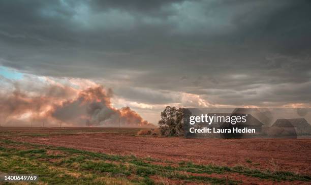 old abandoned structure on the great plains with wildfire - us history stock pictures, royalty-free photos & images