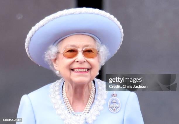 Queen Elizabeth II smiles on the balcony during Trooping The Colour on June 02, 2022 in London, England. The Platinum Jubilee of Elizabeth II is...