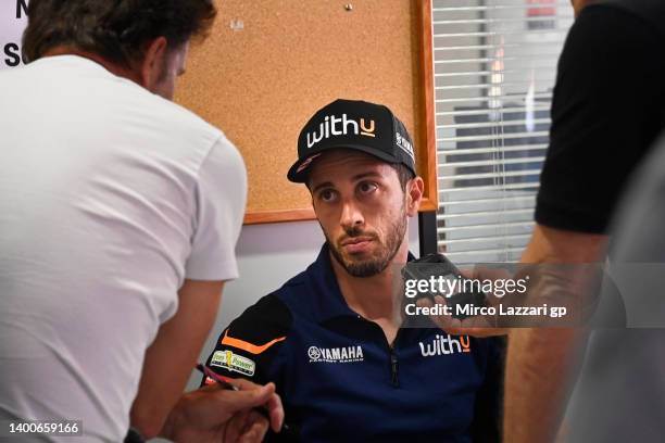 Andrea Dovizioso of Italy and WithU Yamaha RNF MotoGP Team speaks in media center with journalists during the media scrums during the MotoGP of...