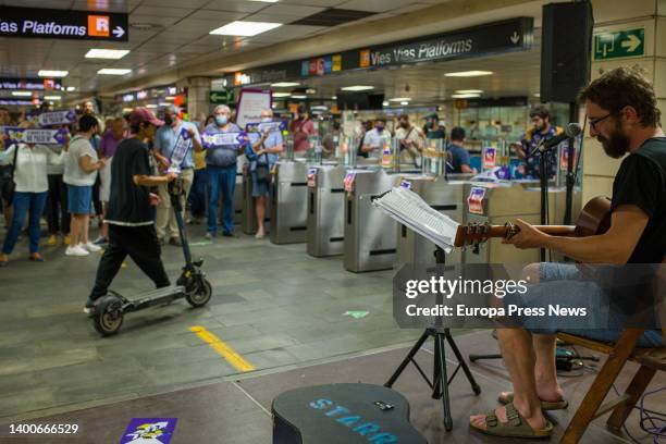 Man plays at the Plaça de Catalunya metro station during a demonstration by the Batec youth collective, June 2 in Barcelona, Catalonia, Spain. The...