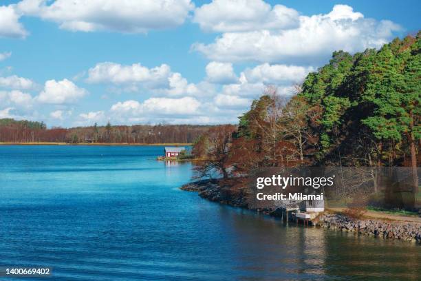 an idyllic red cabin and beach surrounded by beautiful sea views, archipelago scenery, ruissalo, turku, finland - spring finland stock pictures, royalty-free photos & images