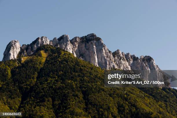 low angle view of mountain against clear sky,annecy,france - annecy bildbanksfoton och bilder