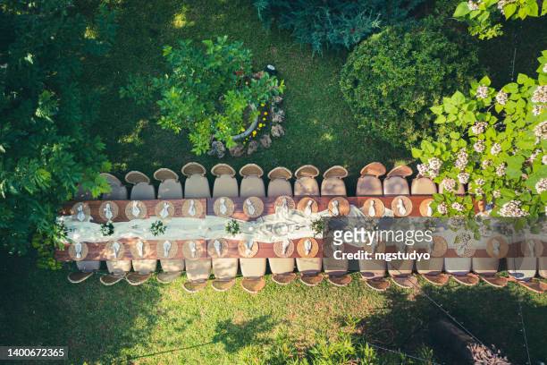 big wedding dinner table in backyard view from above - big wedding reception stock pictures, royalty-free photos & images