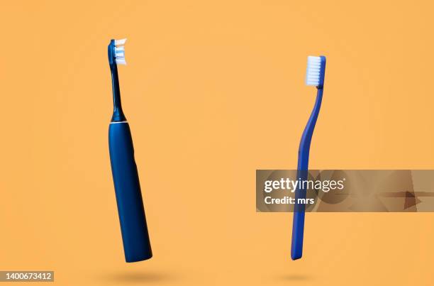 toothbrush and electric toothbrush - toothbrush stock pictures, royalty-free photos & images