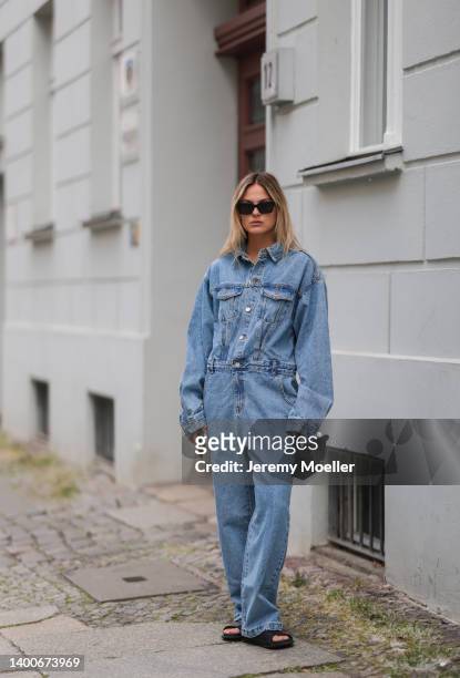 Alessa Winter wearing Chanel black shades, Longchamp black mini bag, The Frankie Shop jeans overall and Inuikii black shoes on May 31, 2022 in...
