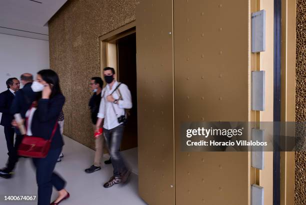 Visitors exit past the armored door of the three-stories vault holding the jewels on display at the Royal Treasure Museum in Ajuda National Palace on...