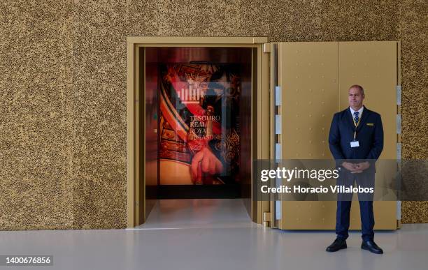Guard stands by the armored door at the entrance of the three-stories vault at the Royal Treasure Museum in Ajuda National Palace on June 02, 2022 in...