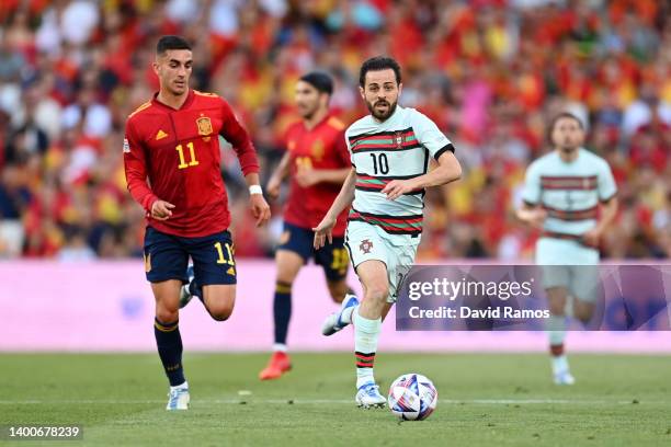 Bernardo Silva of Portugal battles for possession with Ferran Torres of Spain during the UEFA Nations League League A Group 2 match between Spain and...